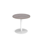 Round table with grey wood-effect top and white base on a white background