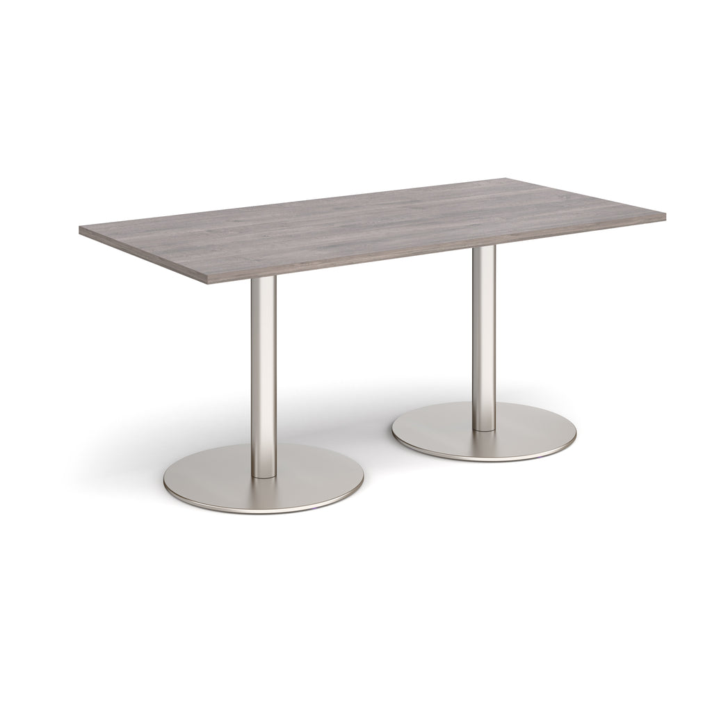 Rectangular table with a grey top and metal legs on a white background