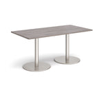 Rectangular table with a grey top and metal legs on a white background