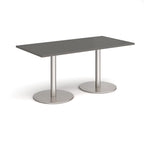 Rectangular table with grey top and metal legs on a white background