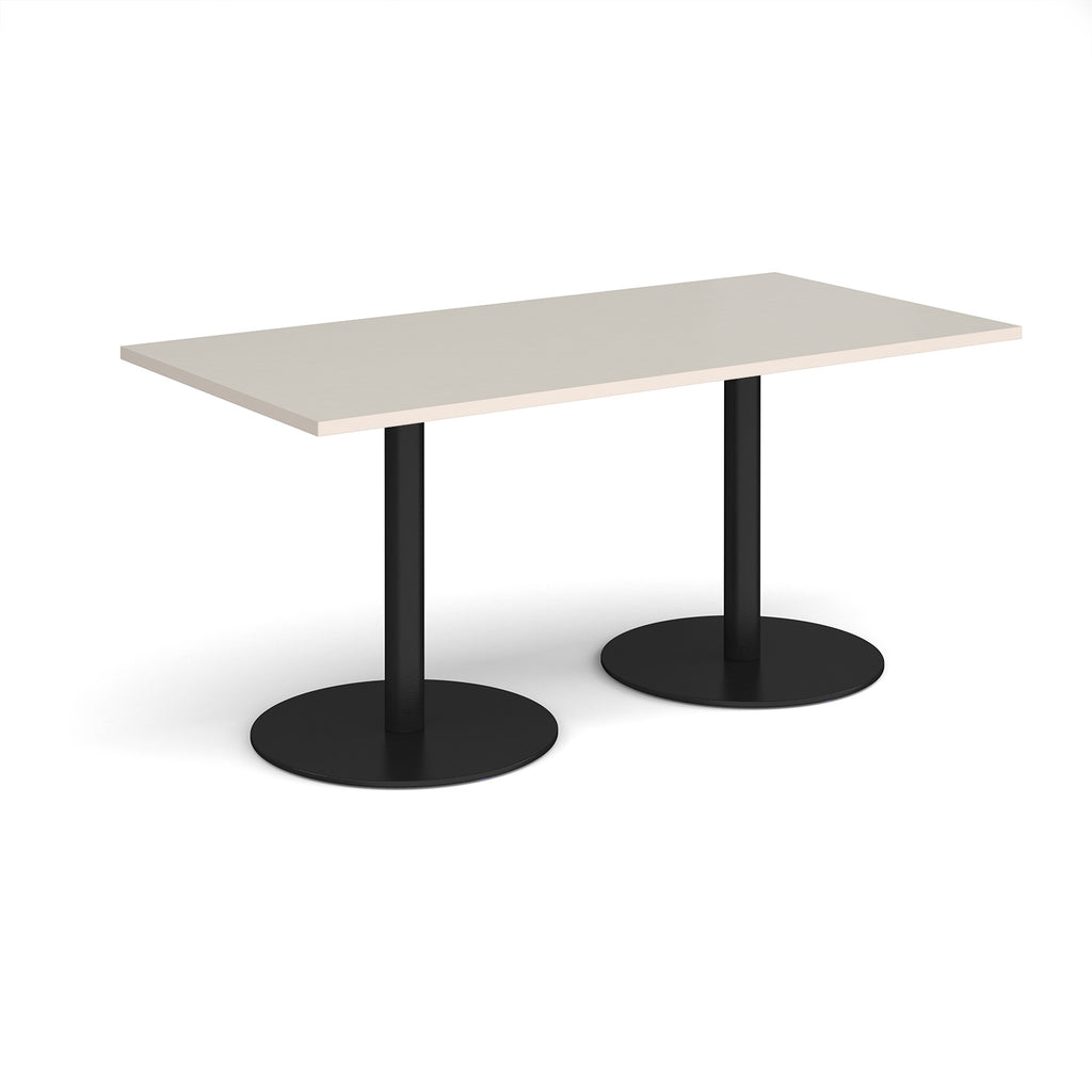 Rectangular table with light grey top and black legs on a white background
