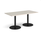 Rectangular table with light grey top and black legs on a white background
