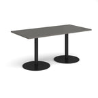 Rectangular table with dark grey top and black legs on a white background