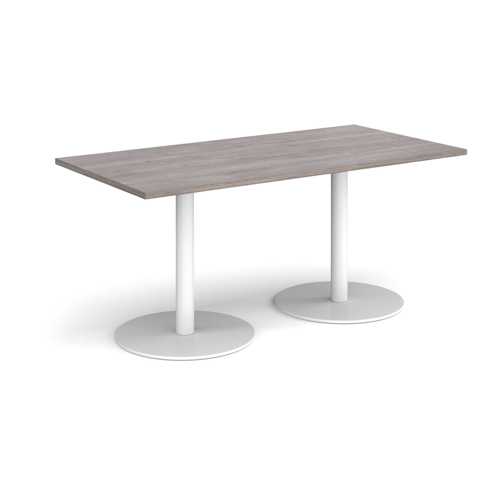 Rectangular table with a grey top and white legs on a white background