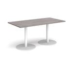 Rectangular table with a grey top and white legs on a white background
