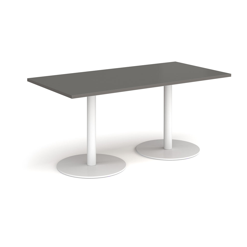 Rectangular table with grey top and white legs on a white background