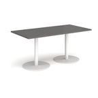 Rectangular table with grey top and white legs on a white background