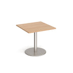 Square table with wood-effect top and metal base on a white background