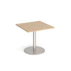 Square table with wood-effect top and metal base on a white background