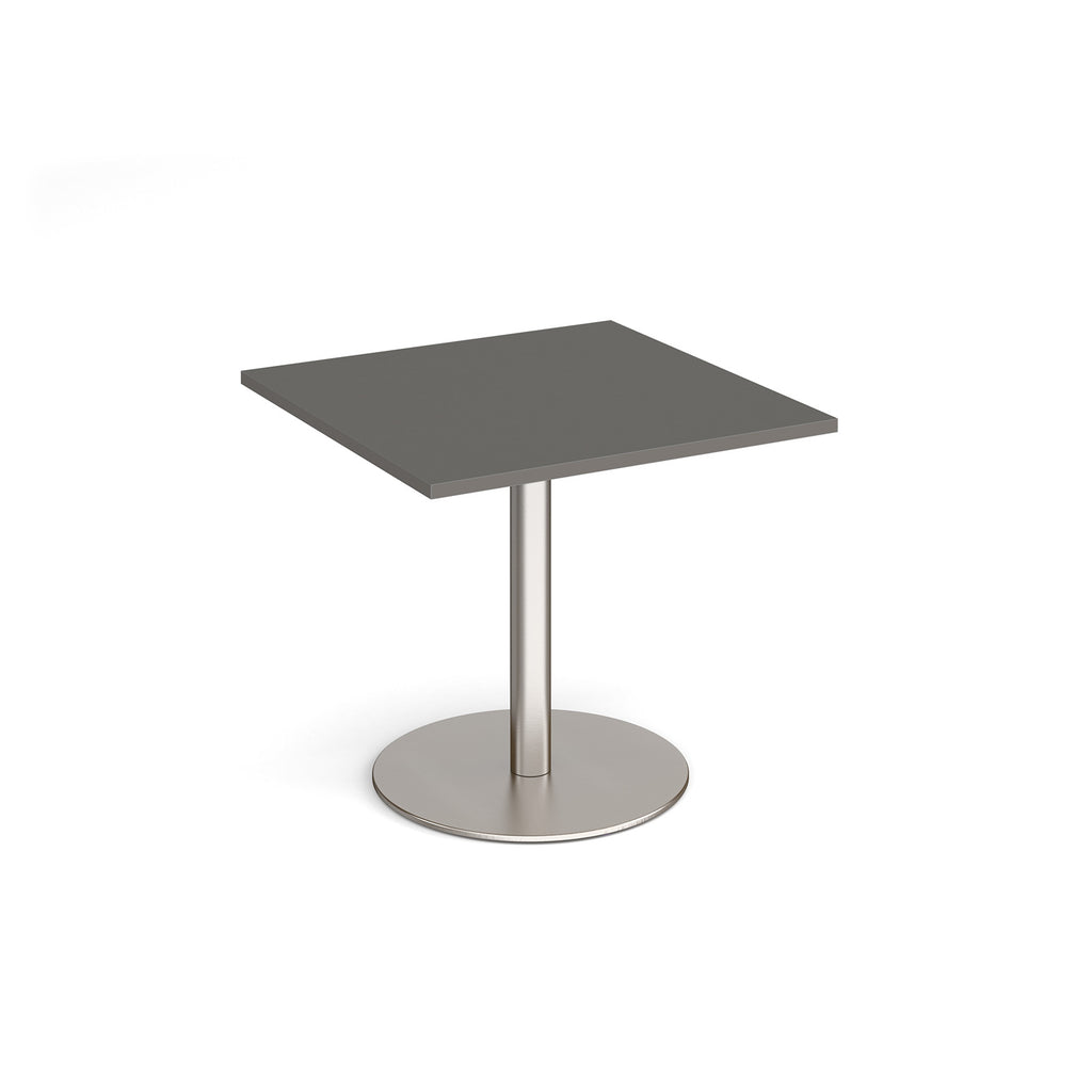 Square table with grey top and metal base on a white background