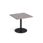 Square table with grey wood-effect top and metal base on a white background