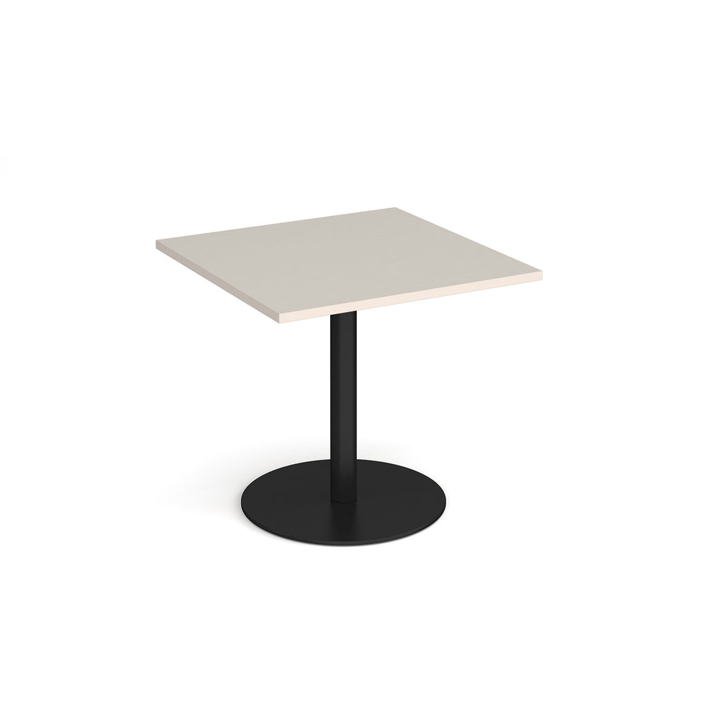 Square table with light grey top and metal base on a white background