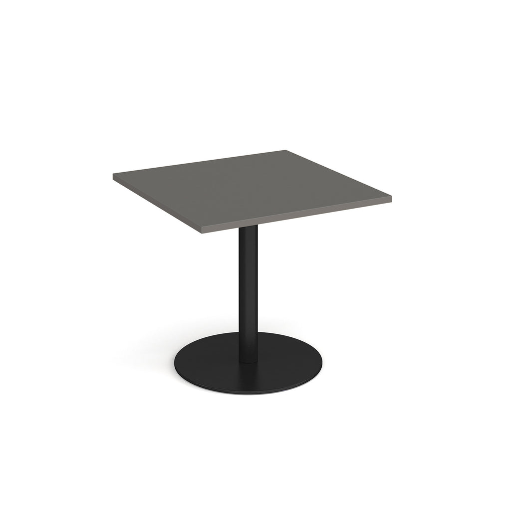 Square table with grey top and metal base on a white background