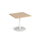 Square table with wood-effect top and metal base on a white background