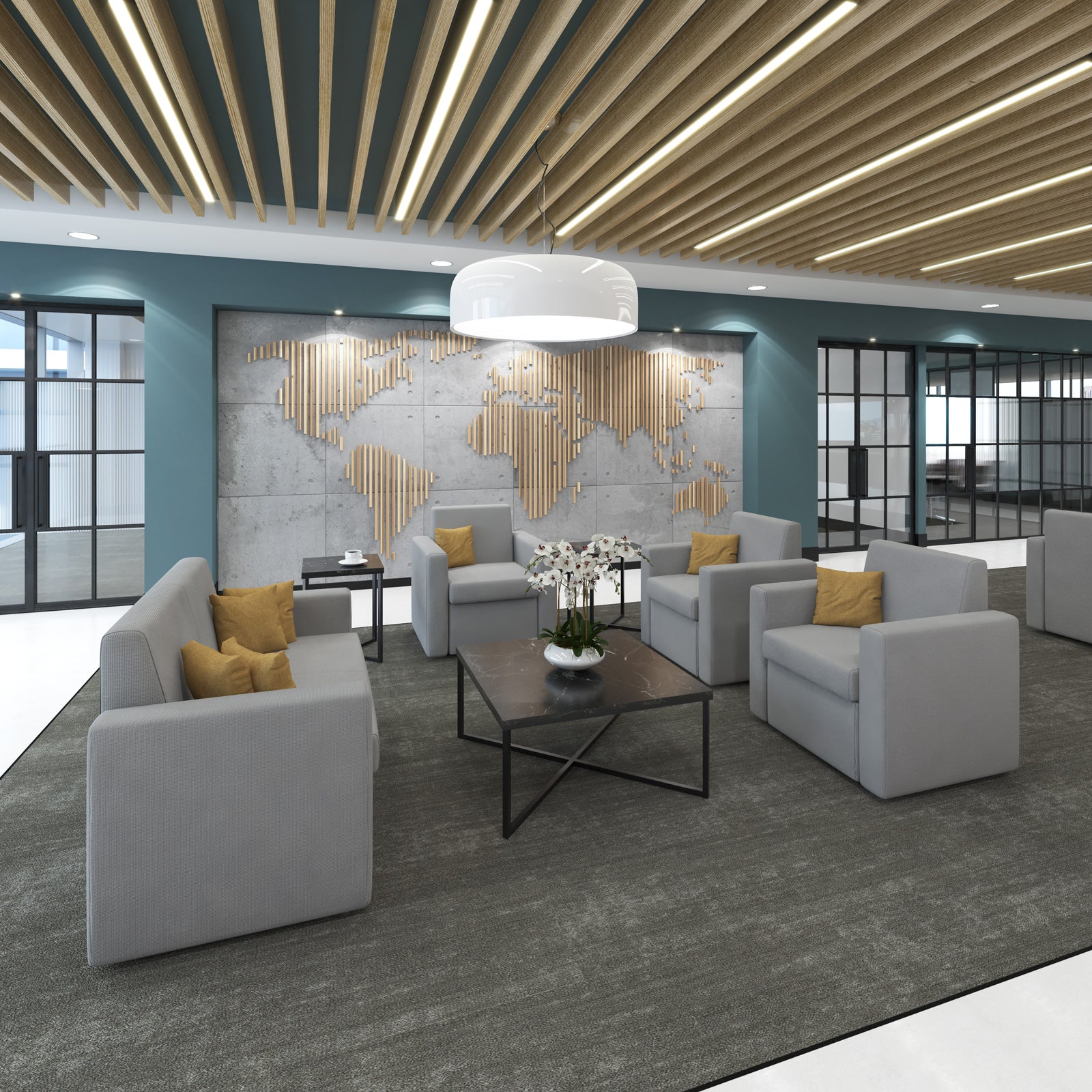 Modern office lounge with gray sofas, a coffee table, and decorative elements.