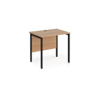 Office desk with wood-effect top and black metal frame on a white background