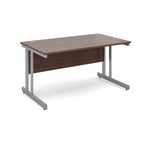 Office desk with wood-effect top and silver metal legs on a white background