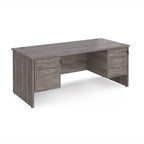 Wooden office desk with multiple drawers on a white background