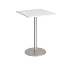 Square white table with a metal base on a white background