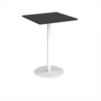 Black square table with white pedestal base on a white background