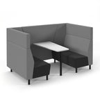 Grey and black modular seating booth with a white table on a white background