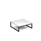 Modern coffee table with white top and black metal frame on a white background