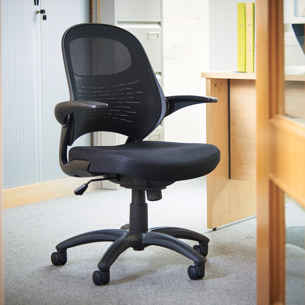 Black office chair in an office setting with a desk and partition.