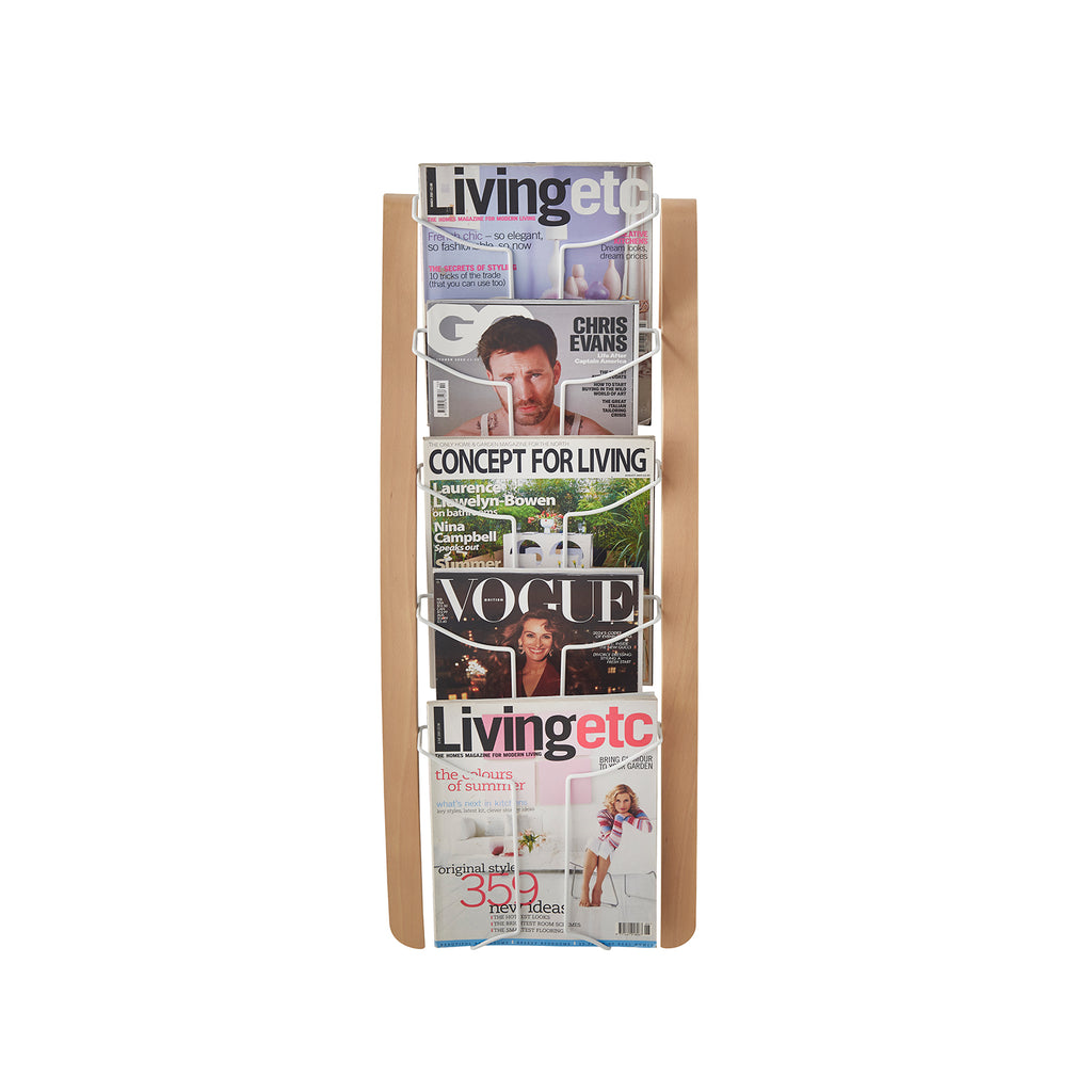 Wood-effect magazine rack with various magazines on a white background