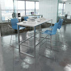 Modern office space with high tables and blue chairs