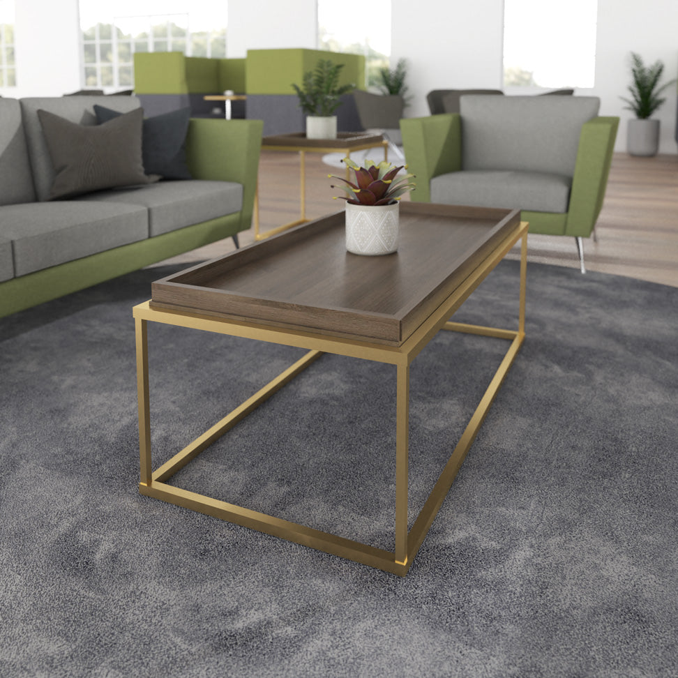 Modern living room with a coffee table and grey and green furniture.