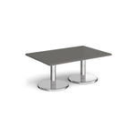 Rectangular coffee table with grey top and chrome base on a white background