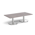 Rectangular coffee table with grey wood-effect top and chrome base on a white background