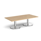Rectangular coffee table with wood-effect top and chrome base on a white background