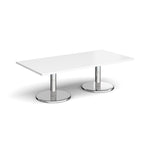 Rectangular coffee table with white top and chrome base on a white background