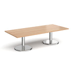 Rectangular coffee table with wood-effect top and chrome base on a white background