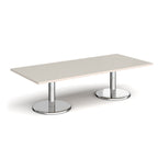 Rectangular coffee table with light grey top and chrome base on a white background