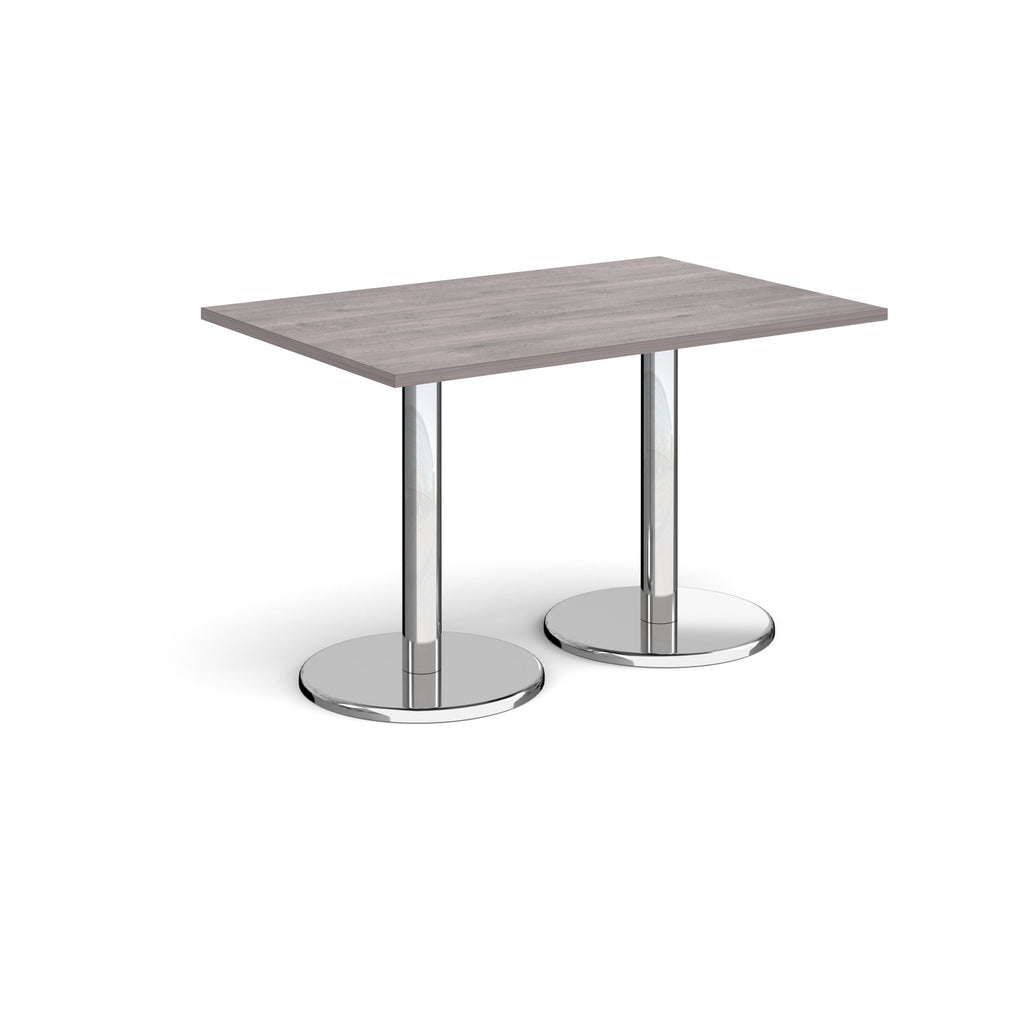 Rectangular table with grey wood-effect top and chrome legs on a white background