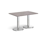 Rectangular table with grey wood-effect top and chrome legs on a white background