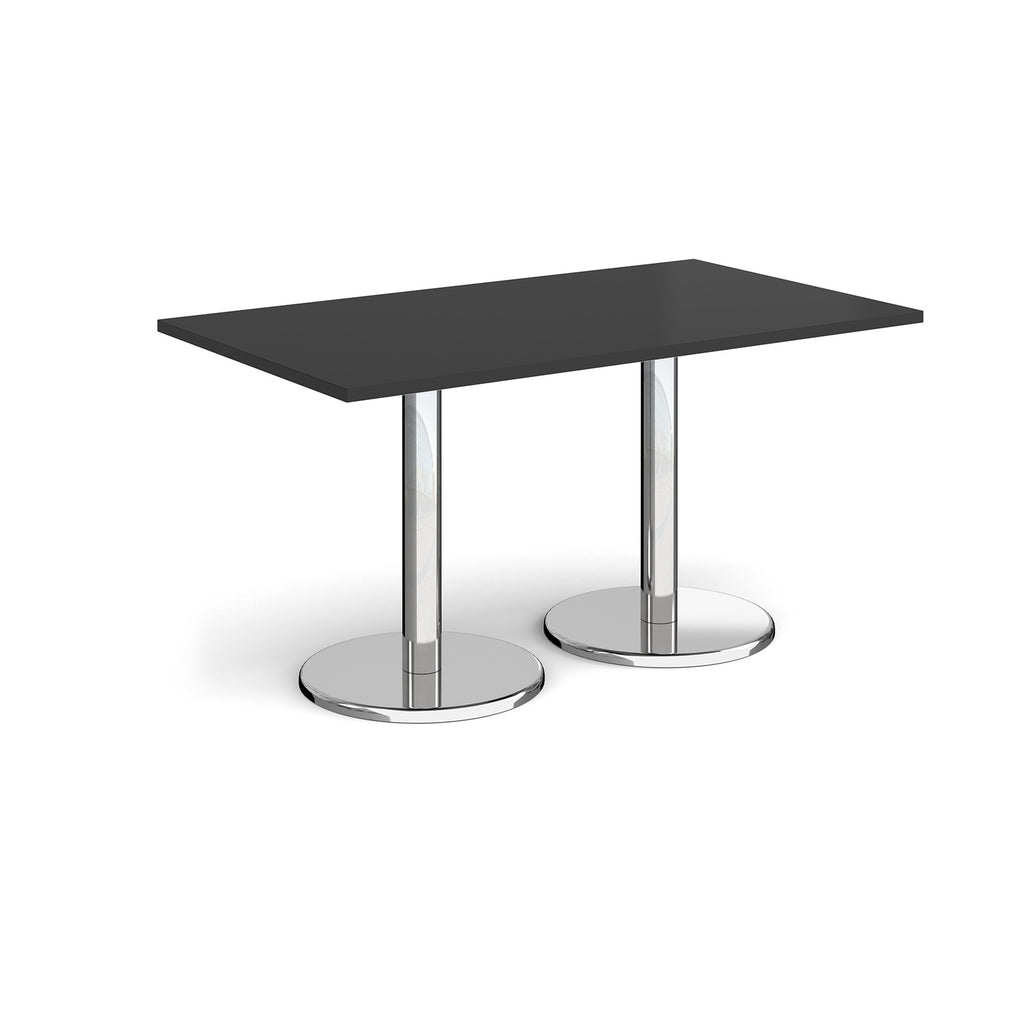 Rectangular table with black top and chrome legs on a white background