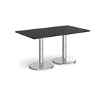 Rectangular table with black top and chrome legs on a white background