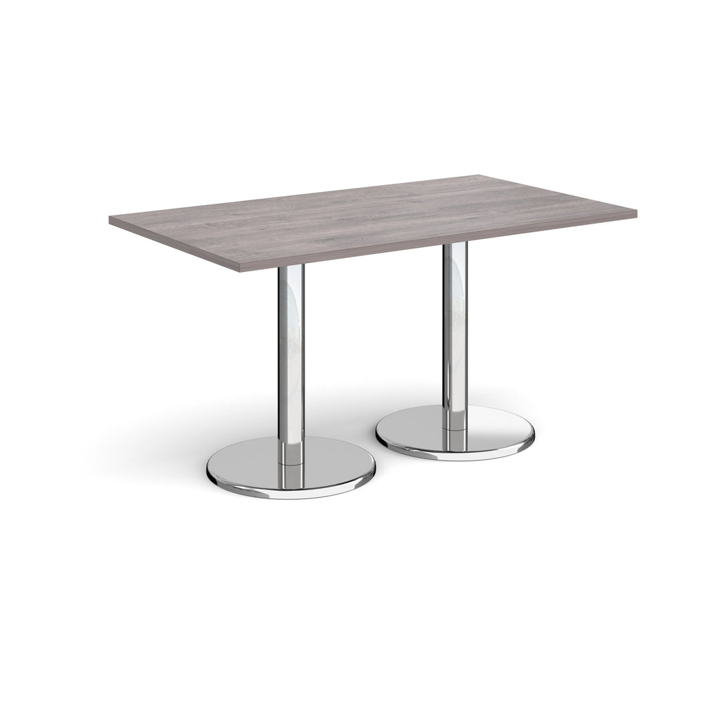 Rectangular table with grey wood-effect top and chrome legs on a white background