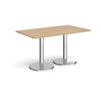 Rectangular table with wood-effect top and chrome legs on a white background