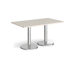 Rectangular table with light grey top and chrome legs on a white background