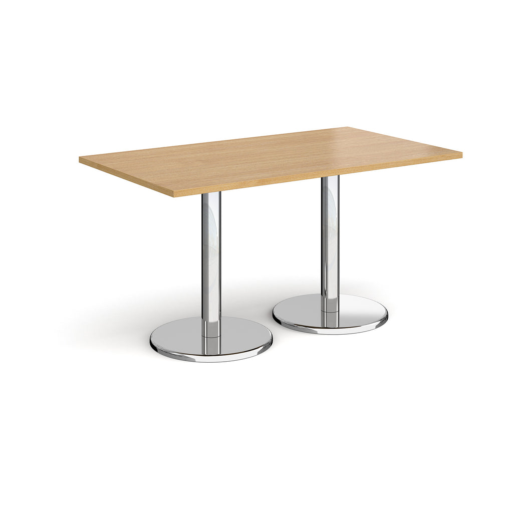 Rectangular table with wood-effect top and chrome legs on a white background