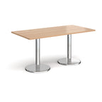 Rectangular table with wood-effect top and chrome legs on a white background