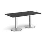 Rectangular table with black top and chrome legs on a white background