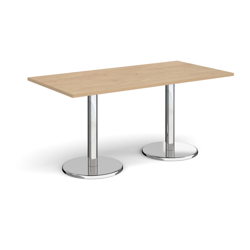 Rectangular table with wood-effect top and chrome legs on a white background