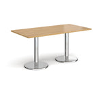 Rectangular table with wood-effect top and chrome legs on a white background