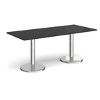 Rectangular table with black top and chrome legs on a white background