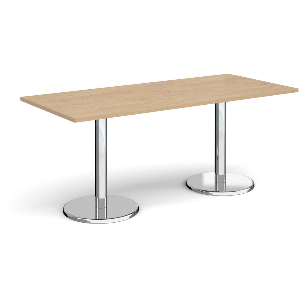 Rectangular table with wood-effect top and chrome legs on a white background